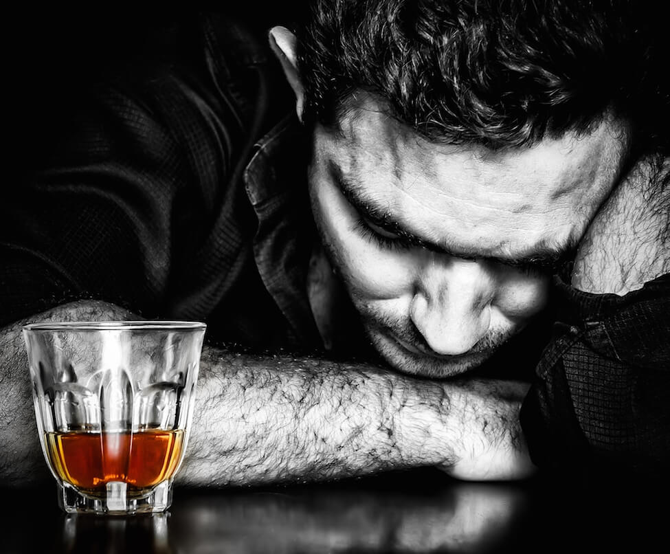 Alcoholism : Dark portrait of a lonely and desperate drunk hispanic man