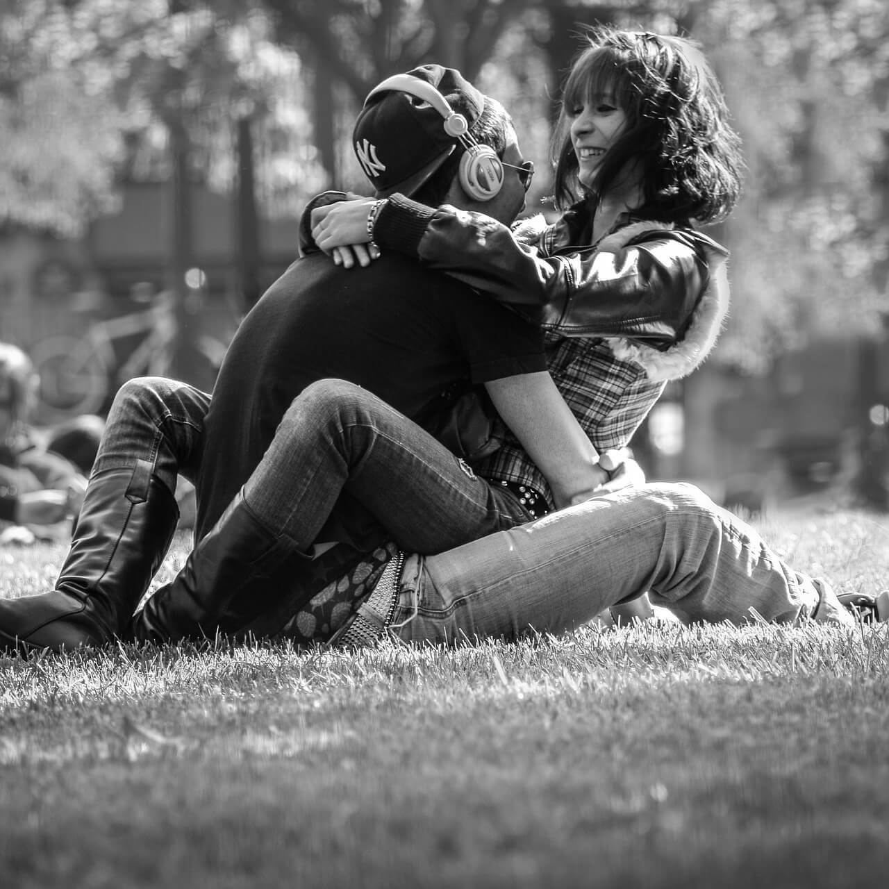 Three Loves Theory: Couple hugging in a park