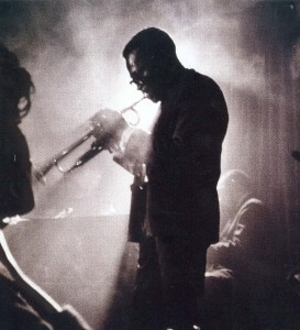 Silhouette of trumpet player in smokey bar
