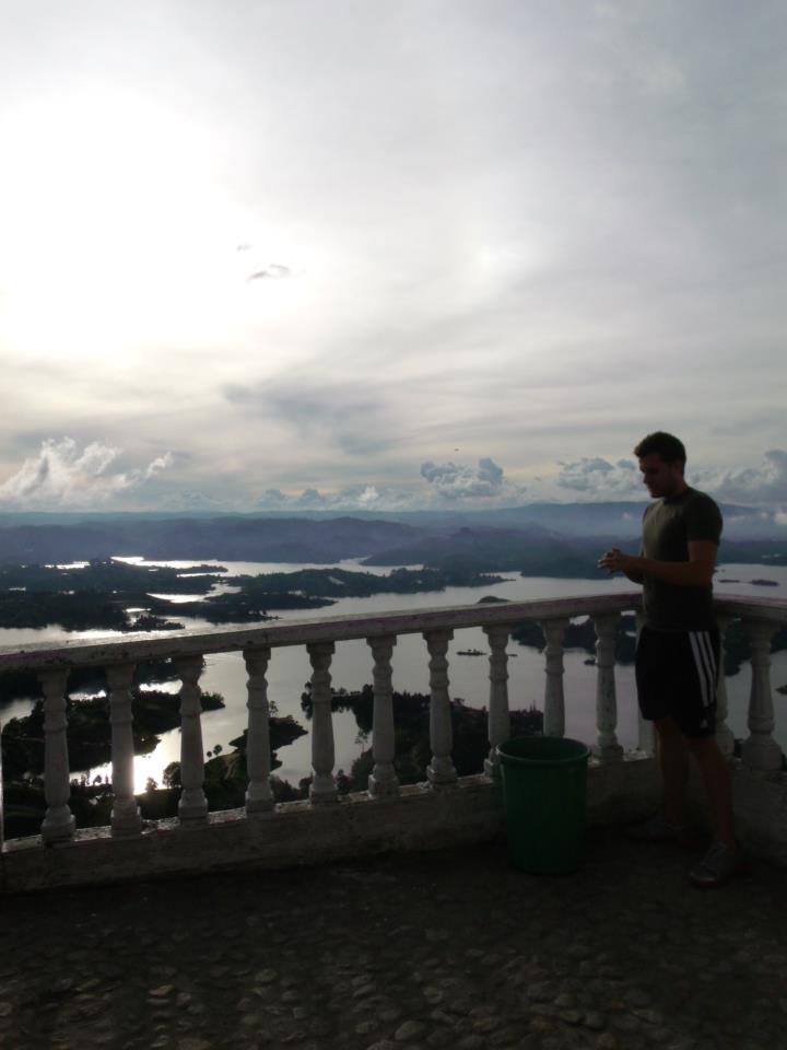 Mark Manson checking his phone in Guatapé, Colombia