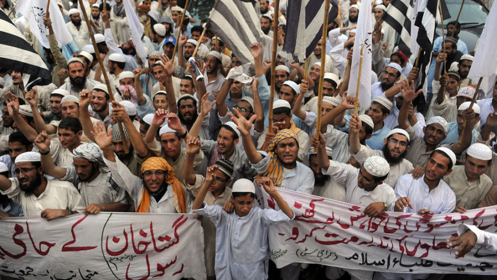 Pakistani Muslims calling for the death of a Christian woman for blaspheming the Prophet Muhammad