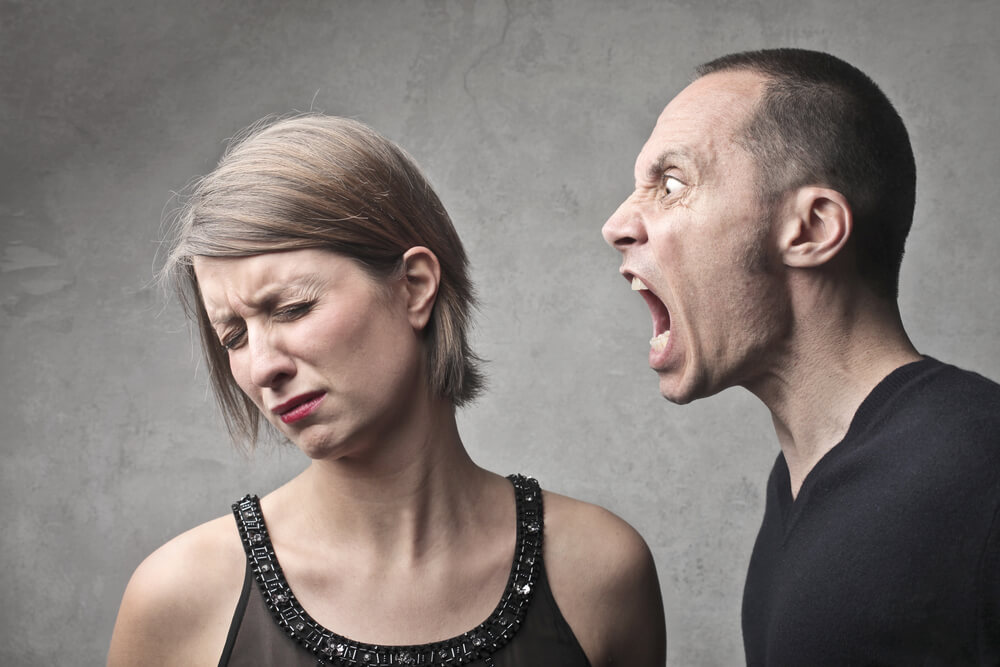 Man screaming at woman