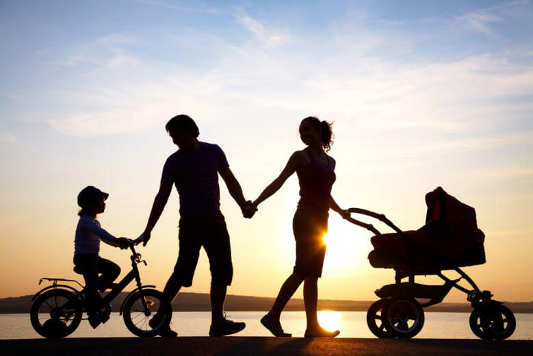 Relationship advice: happy family walking on sunset